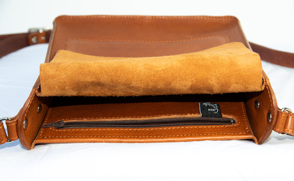 Flora Box crossbody bag in tan veg tanned leather