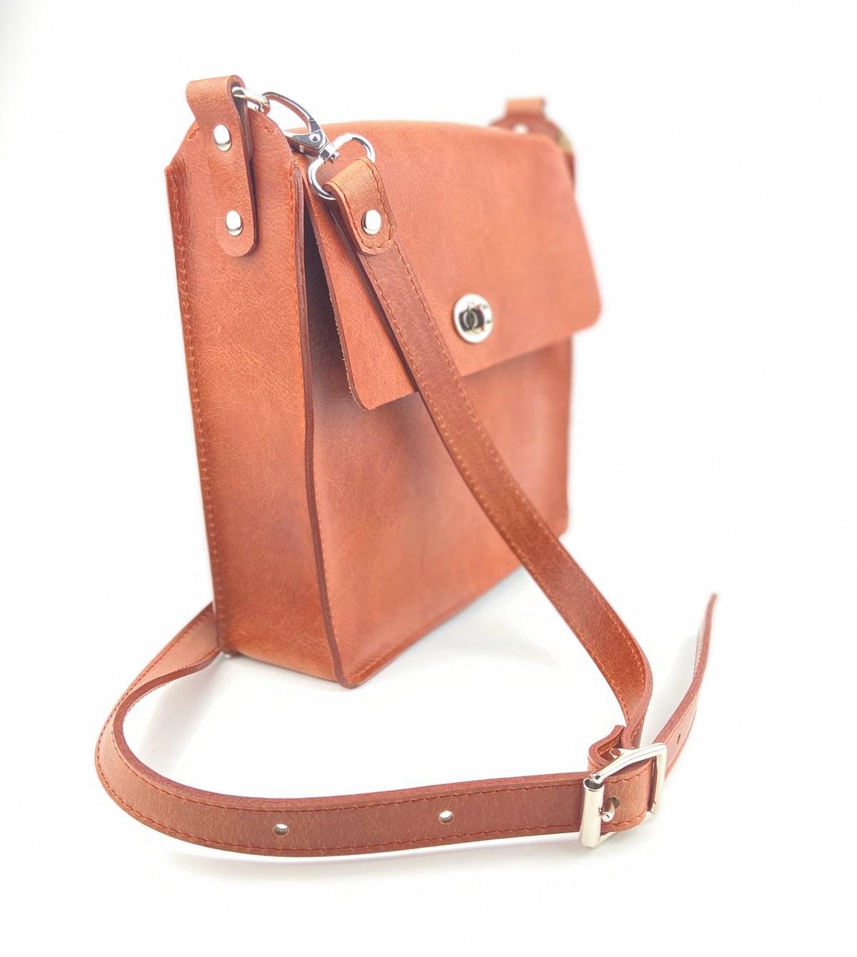 Flora Box crossbody bag in tan veg tanned leather