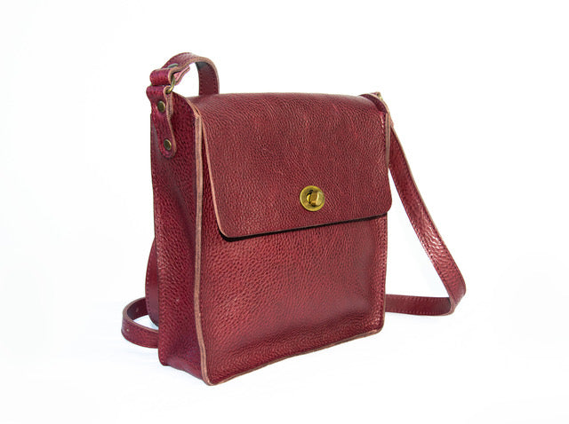 Flora Box crossbody in burgundy veg tan leather