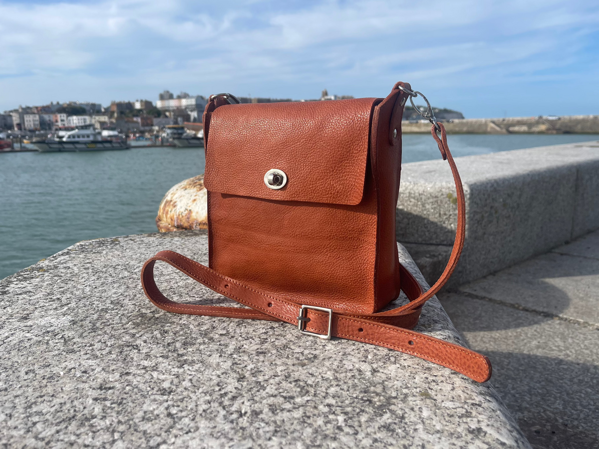 Flora Box crossbody bag in tan veg tanned leather